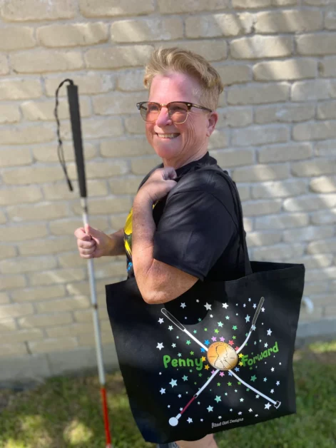 Tricia, from Blind Girl Designs, standing with the Penny Forward totebag hanging over her shoulder