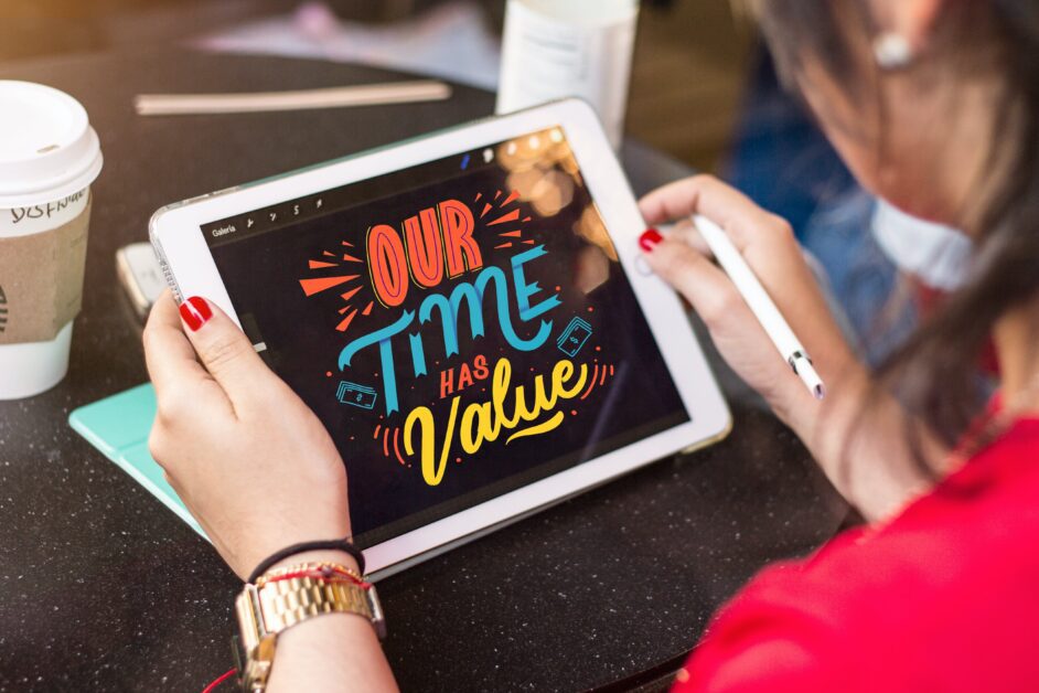 Woman Holding Silver iPad with the words 'Our Time has Value"